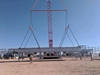 Two Tandemloc telescopic spreader beams lifting a steel structure