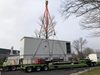 Two Tandemloc Telescopic spreader beams lifting a generator