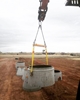 A Rapid Ready beam lifting a utility hole.